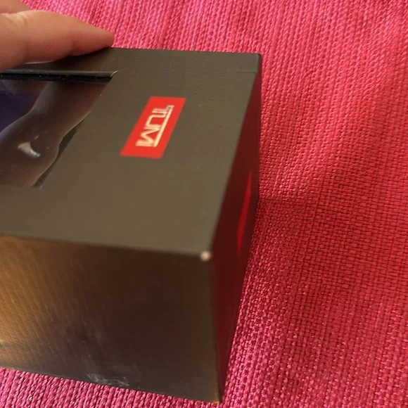 New in box Tumi leather strap- never removed from box - box has small damage
